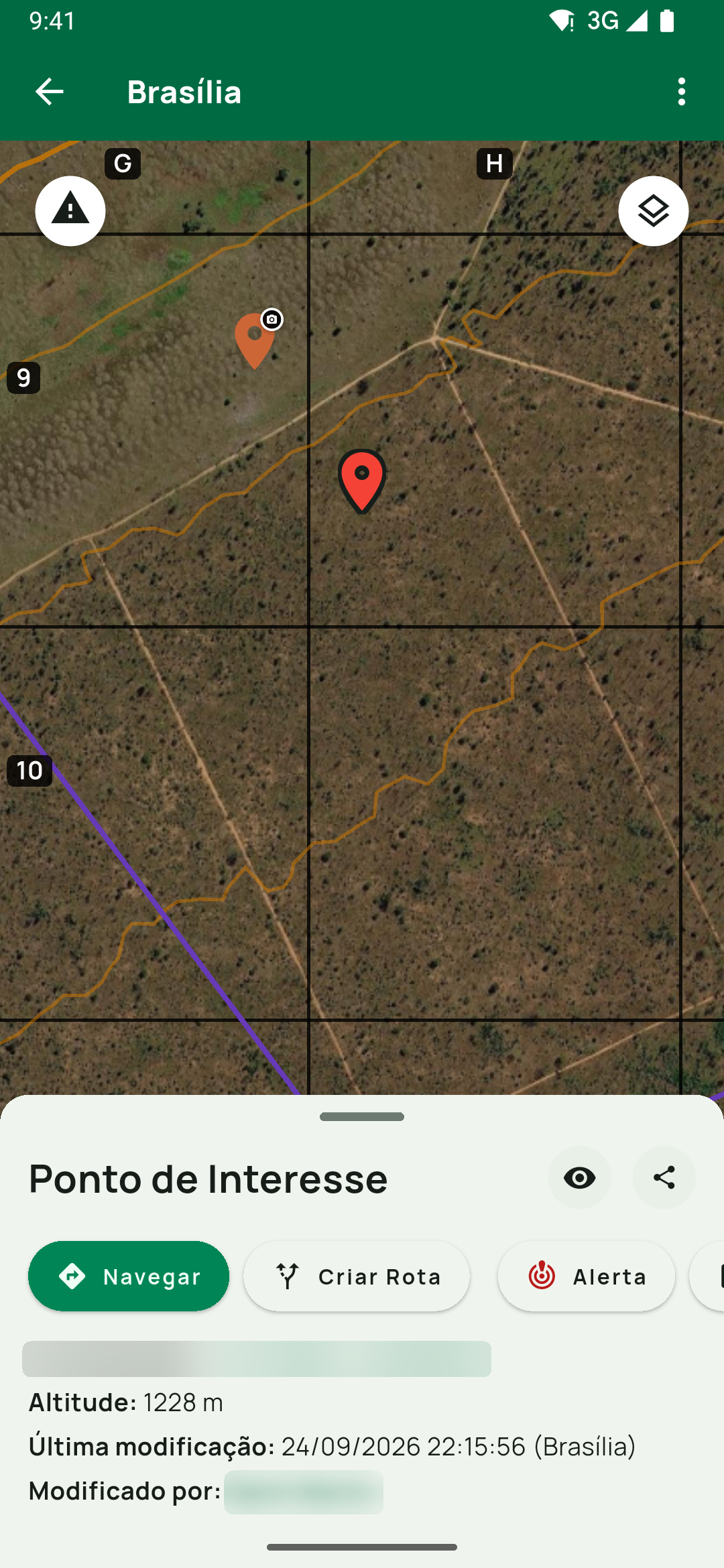 Painel Ponto de Interesse do toque longo, com Navegar, Criar Rota e Alerta, e Altitude: 1228 m abaixo da coordenada.