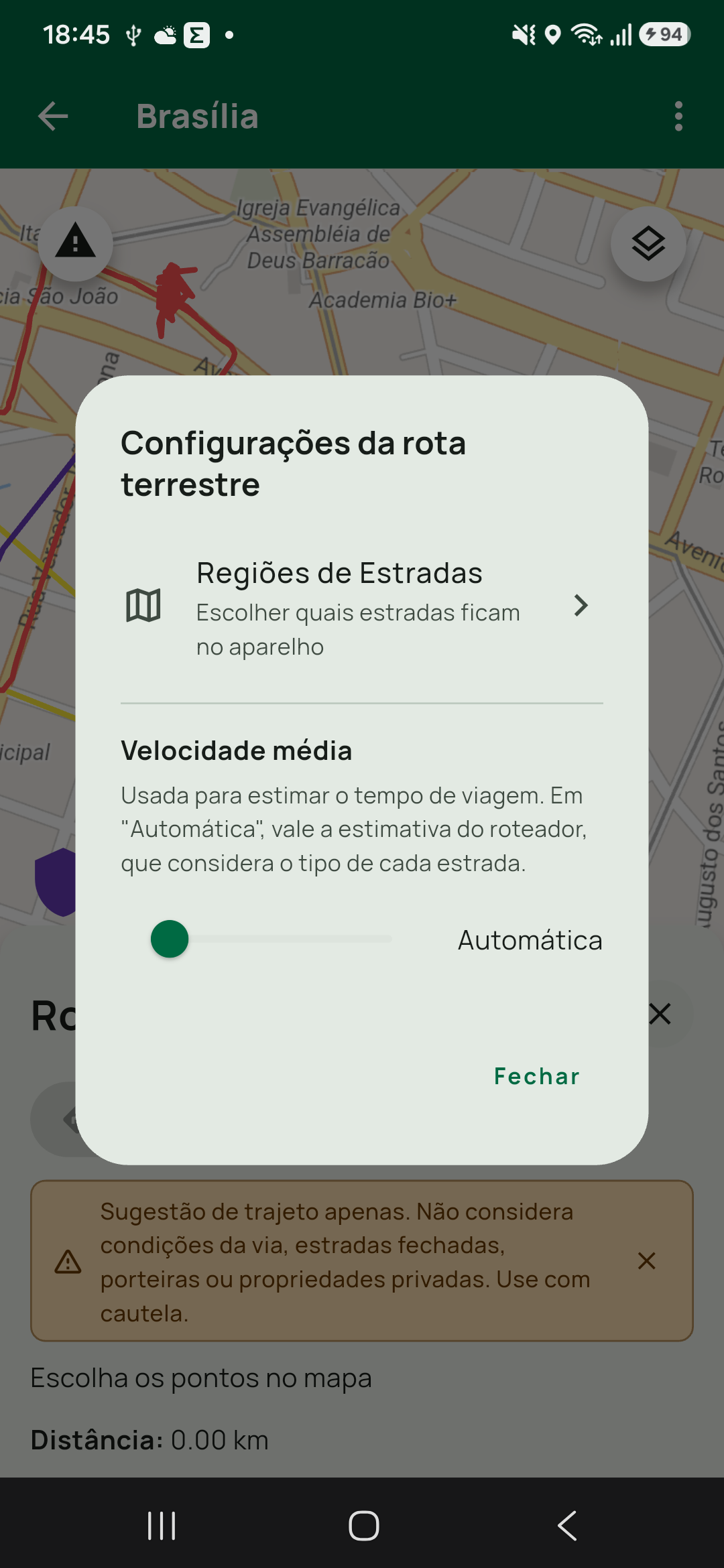 Diálogo Configurações da rota terrestre sobre o painel: Regiões de Estradas (Escolher quais estradas ficam no aparelho), a seção Velocidade média com a explicação e o controle em A